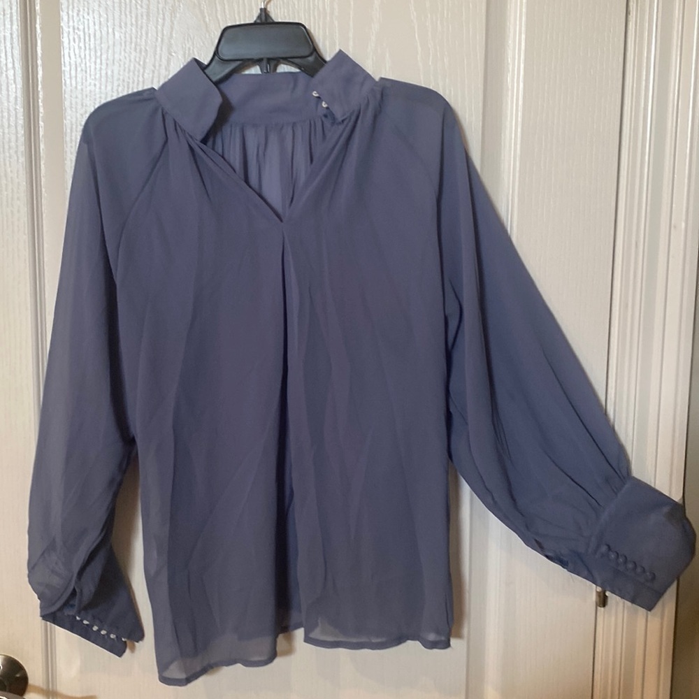 Size small top with puffy sleeves and covered button closure